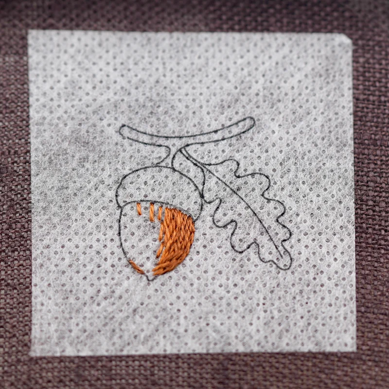Add DMC 434, blending it into DMC 433 with long and short stitches to create a smooth transition between the shades.